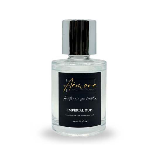 Clear bottle of Aemore Imperial Oud perfume with black label on a white background